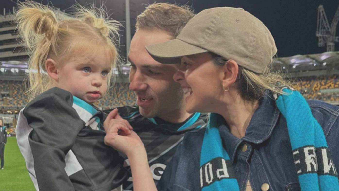 Port Adelaide&#x27;s Jeremy Finlayson with his wife Kellie and their daughter.