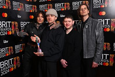LONDON, ENGLAND - MARCH 02: (EDITORIAL USE ONLY. NO PUBLICATIONS DEVOTED EXCLUSIVELY TO THE ARTIST)  (L-R) Oliver Sykes, Matt Nicholls, Lee Malia, and Matt Kean of "Bring Me The Horizon" pose with their Best Alternative/Rock Act award in the winners room at the BRIT Awards 2024 at The O2 Arena on March 02, 2024 in London, England. (Photo by Kate Green/Getty Images)