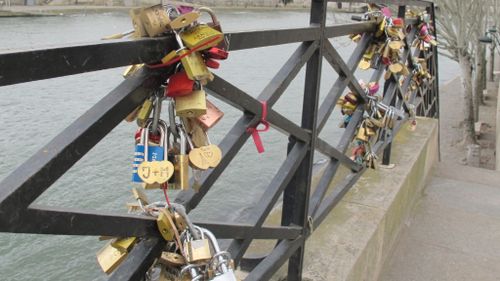 Love locks attached to a railing at Pont des Arts' pedestrian bridge in February. (AFP)
