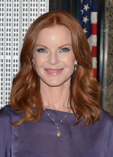 Actress Marcia Cross visits The Empire State Building in honor of first annual International Day of the Girl, on October 10, 2012 in New York City.