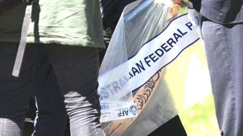 Police retrieved a sword from one of the houses searched during this morning's terror raids. (AAP)