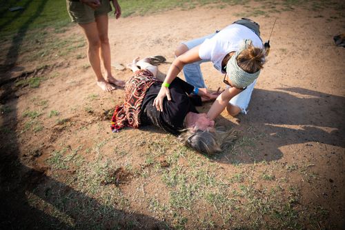 A man on horseback has been arrested after he allegedly knocked over a woman while riding into an anti-Adani protest in central Queensland. 