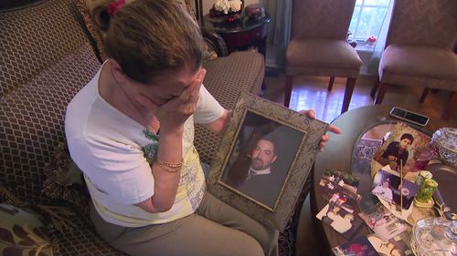 Firouzeh Firouzabadi with a photo of her son Reza Zavvar.