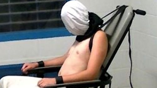 A teenage boy restrained using a 'spit hood' at Don Dale Youth Detention Center. (ABC)