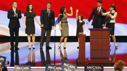 Sarah Palin, right, is pictured with her family on stage during the 2008 US election campaign where she was the Republican vice presidential nominee. Her son Track is on the far left. (Photo: AP)