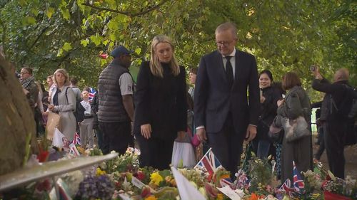 P﻿rime Minister Anthony Albanese emerged from the crowd in Green Park with his partner Jodie and a bouquet for the late monarch.