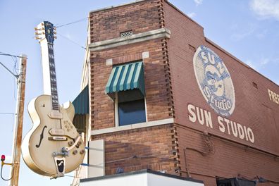 Memphis,  Tennessee, USA -12th October 2010:Giant Gibson guitar sign, with Bigsby vibrato, outside the Sun Studio, made famous as the recording studio of such megastars as Elvis Presley, Johnny Cash, Carl Perkins, Roy Orbison, Jerry Lee Lewis and many others.