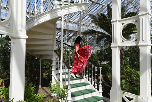 A woman looks at plants in the newly restored Victorian Temperate House. (AAP)