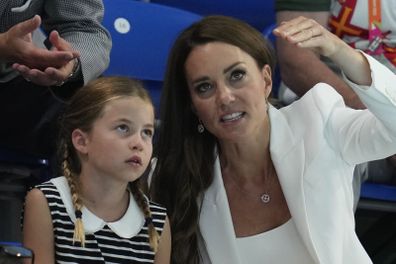 Kate, Duchess of Cambridge, right, and Princess Charlotte watch a swimming event at Sandwell Aquatics Center on day five of the 2022 Commonwealth Games in Birmingham, England, Tuesday, Aug. 2, 2022.