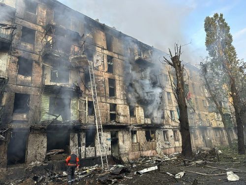 Emergency workers extinguish a fire after missiles hit a multi-story apartment building in Kryvyi Rih, Ukraine, Tuesday, June 13, 2023.