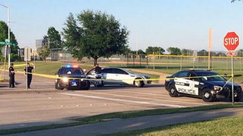 Police cars outside the event. (NBC News / Twitter)