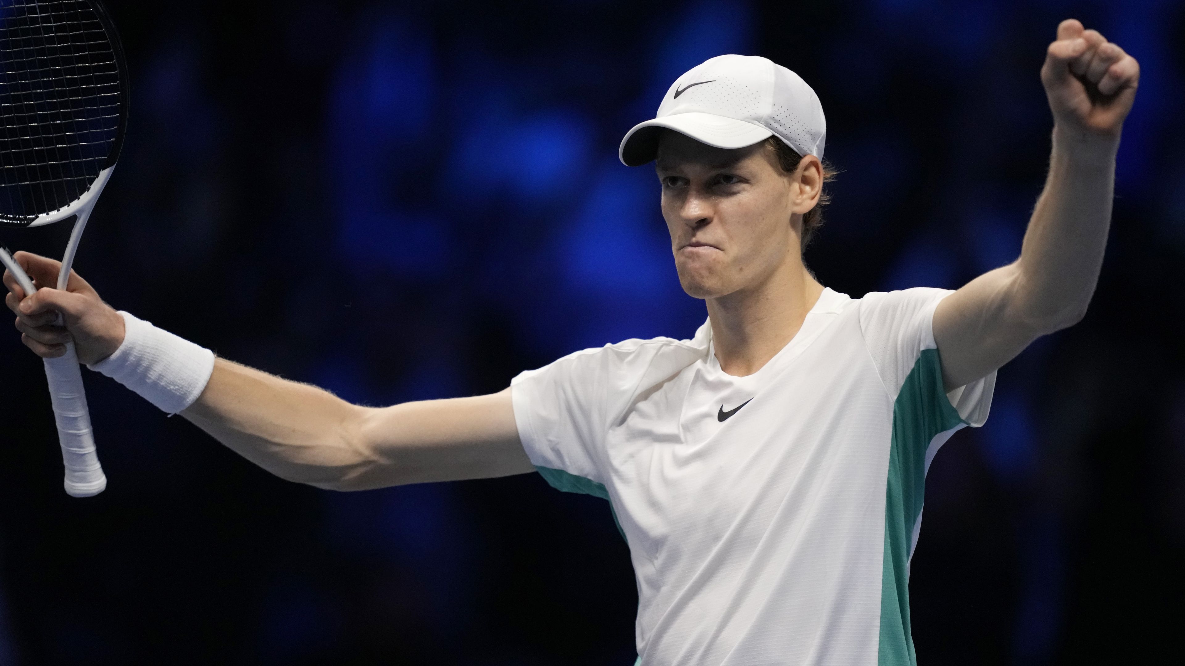 Italy&#x27;s Jannik Sinner celebrates beating Novak Djokovic.