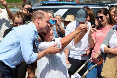 Prince William, the Duke of Cornwall poses for a selfie with a well-wisher, during a visit to Fistral Beach on May 9, 2024 in Newquay, Cornwall