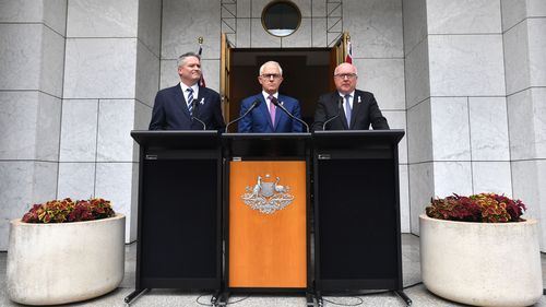 Acting Special Minister of State Senator Mathias Cormann,Prime Minister Malcolm Turnbull and Attorney-General George Brandis announce the legislation at Parliament House. (AAP)