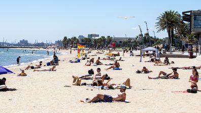 People on St. Kilda beach on Christmas Eve in Melbourne.
