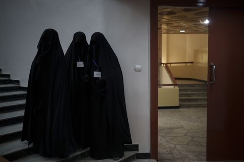 Women stand inside an auditorium at Kabul University's education centre during a demonstration in support of the Taliban government in Kabul, Afghanistan, Saturday, September 11, 2021.