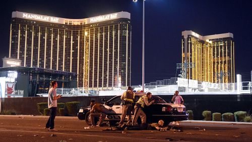 Police on guard outside Mandalay Bay resort from which Paddock opened fire before shooting himself. (Getty)