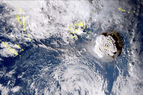 In this satellite image taken by Himawari-8, a Japanese weather satellite, and released by the agency, shows an undersea volcano eruption at the Pacific nation of Tonga Saturday, Jan. 15, 2022. An undersea volcano erupted in spectacular fashion near the Pacific nation of Tonga on Saturday, sending large waves crashing across the shore and people rushing to higher ground. (Japan Meteorology Agency via AP)