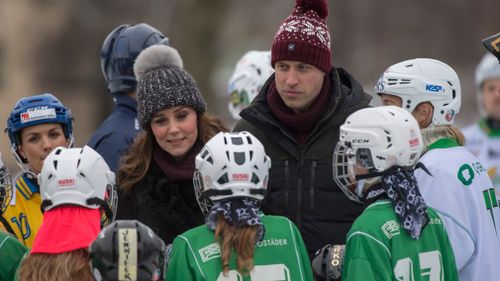 The royal couple talk to bandy players. (PA)