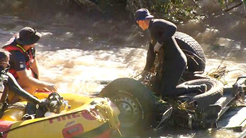 A raft team and a diver have made it to Mr Hornman's vehicle and are assessing how to retrieve it.