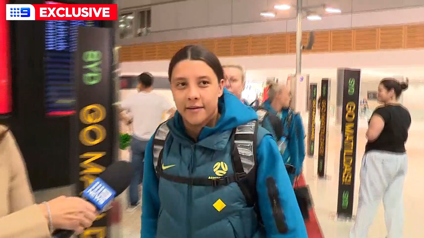 Sam Kerr speaks to a 9News reporter at Sydney Airport ahead of the Matildas&#x27; round of 16 match against Denmark.