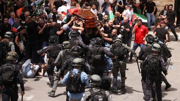 Israeli security forces clashed with family and friends of Al Jazeera reporter Shireen Abu Akleh while they were carrying her coffin during her funeral in Jerusalem.