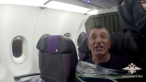 A man was taped to his seat mid-flight.