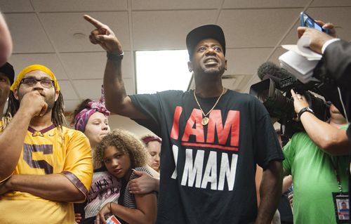 A friend of Philando Castile, who was also shot by police, interrupts a press conference on the Ruszczyk death in July. Picture: AAP