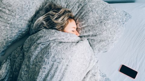 Woman sleeping in bed 
