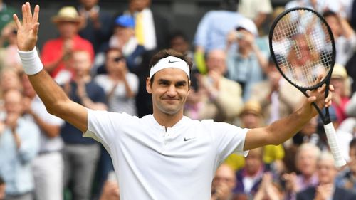 Roger Federer of Switzerland celebrates after winning the Gentlemen' singles semi-finals of the Wimbledon tennis tournament against Tomas Berdych of Czech Republic at All England Tennis Club in London on July 14, 2017. (AFP)