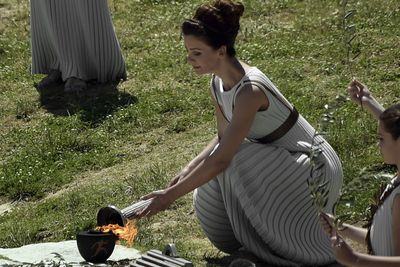 The Olympic flame is lit by a concave mirror that concentrates the sun's rays.