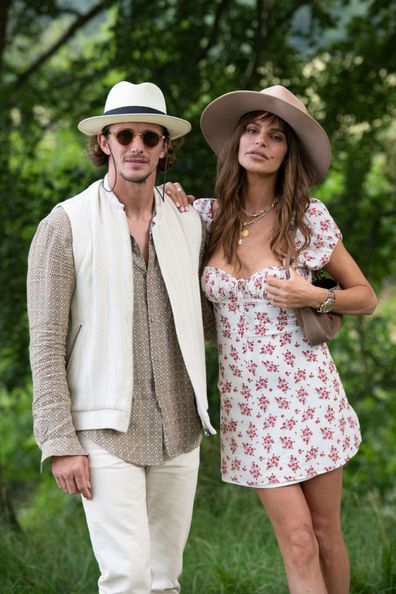 OXFORD, ENGLAND - AUGUST 03: Actor, Fashion designer and founder of Prevu Studio Jake Hall wears all Prevu Studio with Missé Beqiri wearing a Reformation dress, Prevu hat, Foundrae necklace at Wilderness Festival 2019 at Cornbury Park on August 3, 2019 in Oxford, England. (Photo by Kirstin Sinclair/Getty Images)