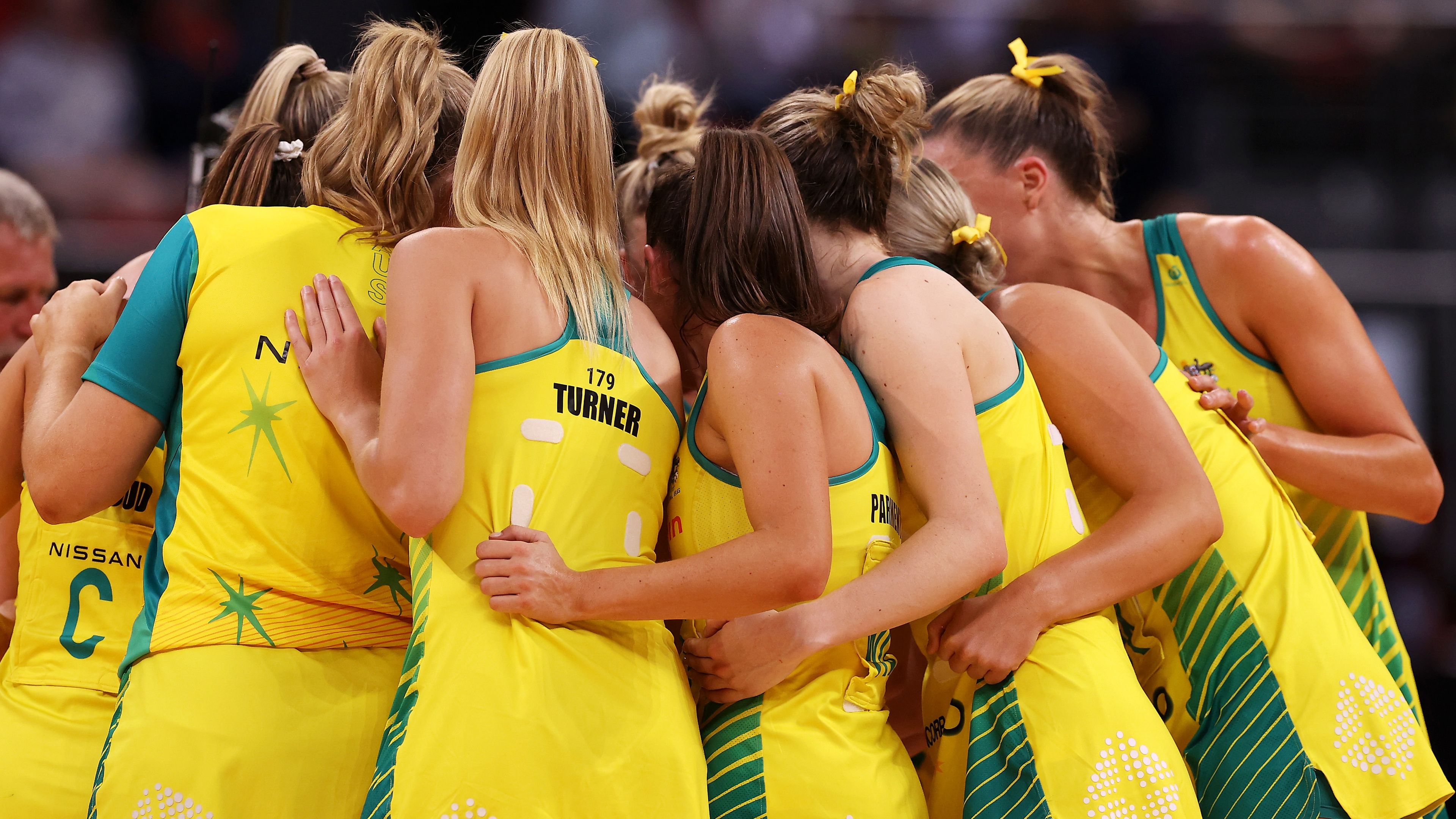 The Australian team form a huddle as they celebrate victory during game two of the International Test series between the Australia Diamonds and the England Roses 