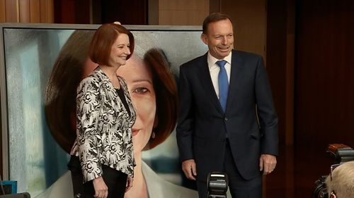 The former leaders smile for the cameras.