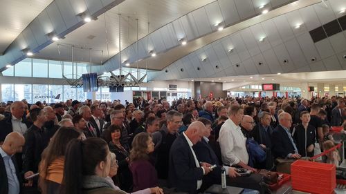 Melbourne Airport's Qantas Terminal has large queues following the evacuation. Picture:John Tomczyk‏