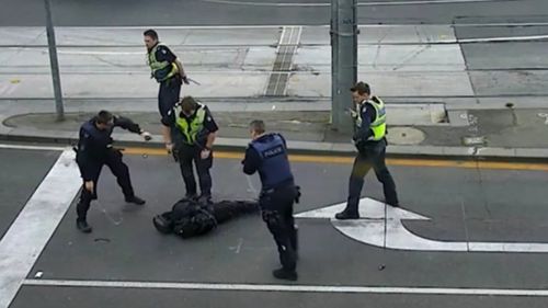 One police officer then sprays the teen with capsicum spray before he lunges at him, knocking the officer to the ground.