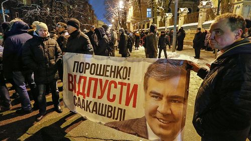 Supporters of former Georgian president Mikheil Saakashvili protest in Kiev against his deportation. (Photo: AP).