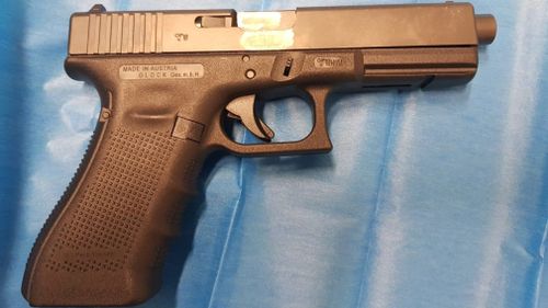 A 19-year-old driver has been charged with 10 offences after police stopped him in Granville, in Sydney's west, and discovered a golden gun, drugs and $4500 in cash. Picture: Supplied.