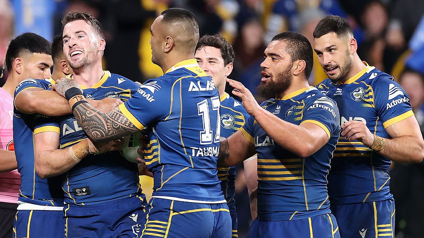 Parramatta Eels players celebrate with Clint Gutherson