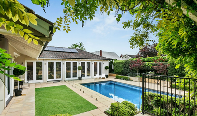 Property with resort-style pool on the market.