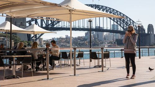 Many owners say it won't be sustainable for them to reopen if they are forced to close for a fortnight whenever a case is linked to the venue. Diners eat at the Portobello Caffe at Circular Quay on June 01, 2020 in Sydney, Australia. 