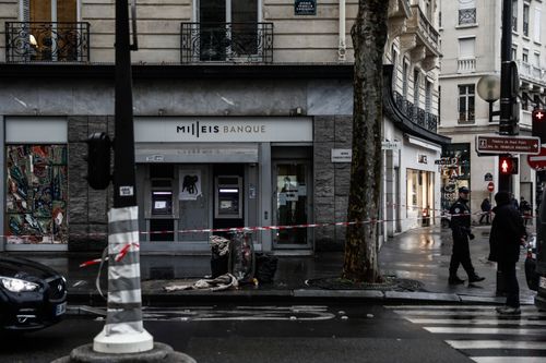 A group of armed robbers conducted a daring heist at a high-end bank on the Champs Elysees in Paris yesterday.