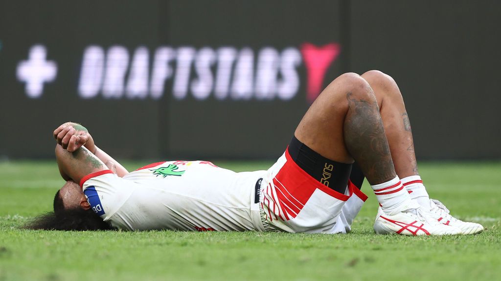 Moses Suli lays on the field. 