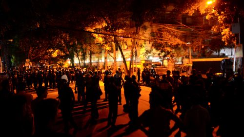 Authorities near the Dhaka restaurant. (AFP)