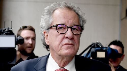 Geoffrey Rush arrives to court for the judgement.