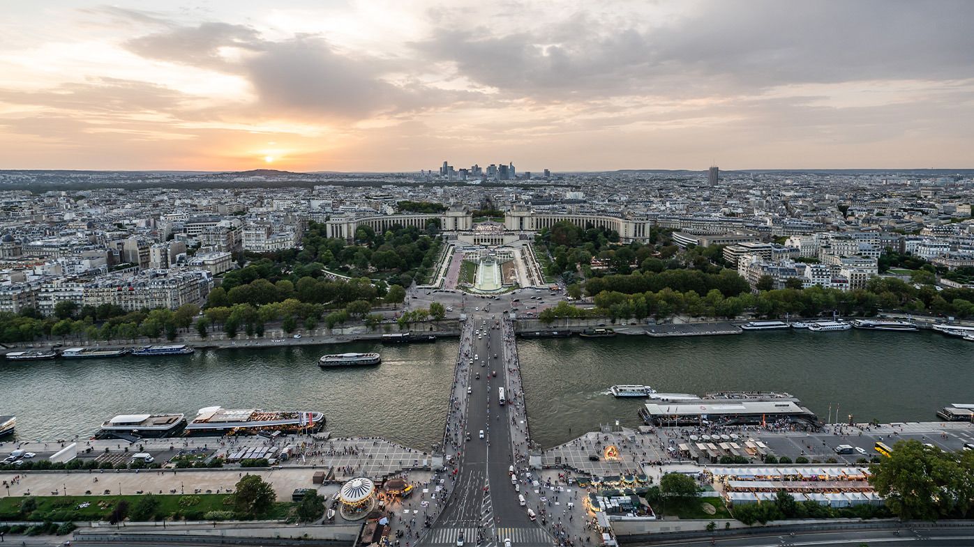 A picture of Paris, including the Seine River, taken from the Eiffel Tower.