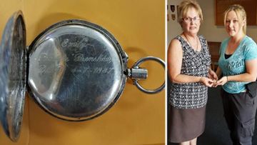 The engraved silver fob watch and the owner, Judy, receiving it from a NSW Police officer. (Photo: NSW Police).
