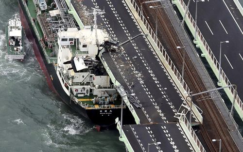 A tanker is seen after it slammed into the side of a bridge connecting the airport to the mainland, damaging part of the bridge and the vessel in Osaka, western Japan