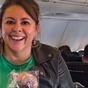 Woman hands out Air New Zealand lollies on Qantas flight