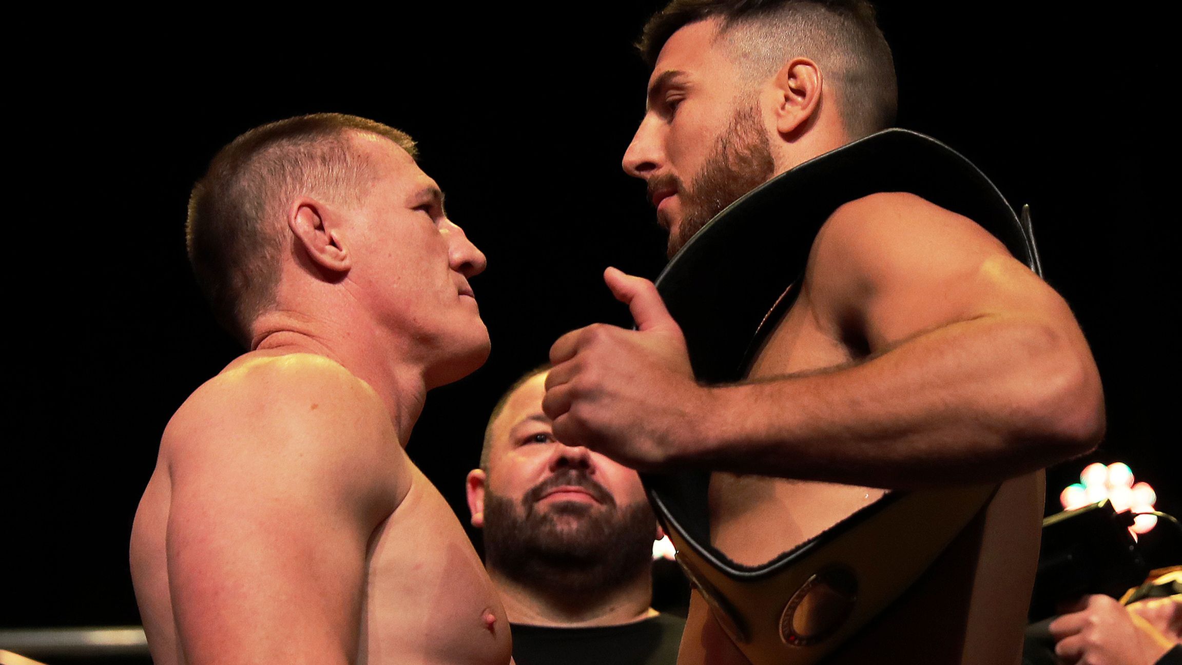 Paul Gallen faces off with opponent Kris Terzievski during the King of the Castle weigh-in at Civic Theatre in Newcastle.